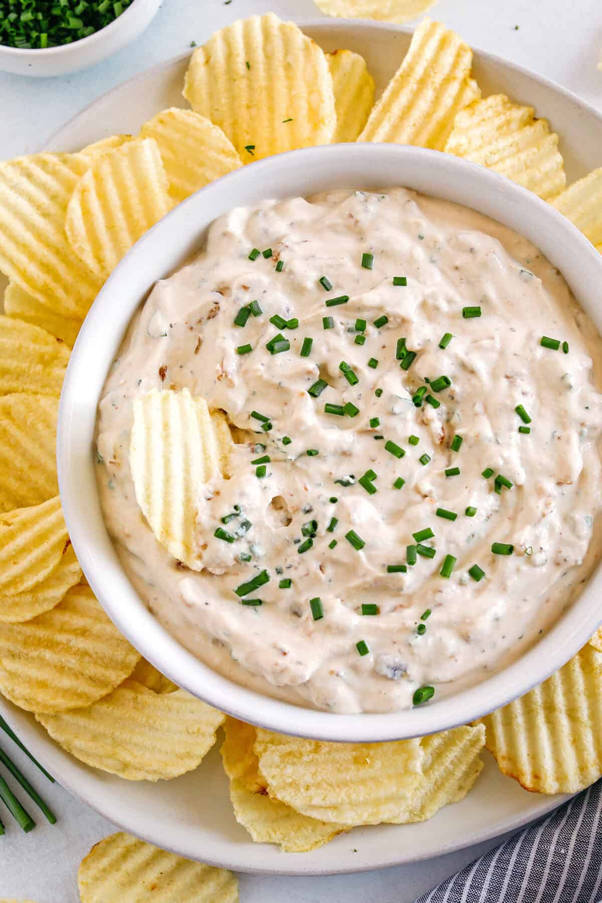 Delicious High Protein French Onion Dip made healthier with protein-packed cottage cheese, caramelized onions, and fresh herbs for the perfect dip to serve with chips, veggies and crackers!